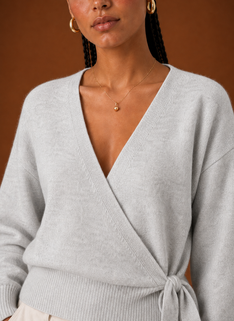 Light grey wrap sweater, tie waist and V-neck detail